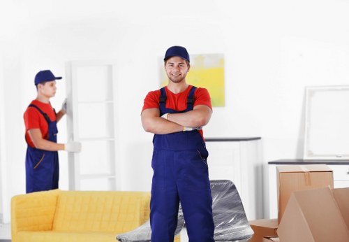Moving van safety image showing careful loading and protective equipment
