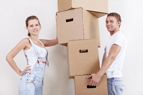Careful loading of boxes and household items into a moving van